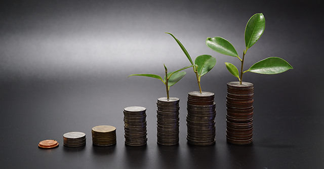 Grow your money - coins with plants growing on top